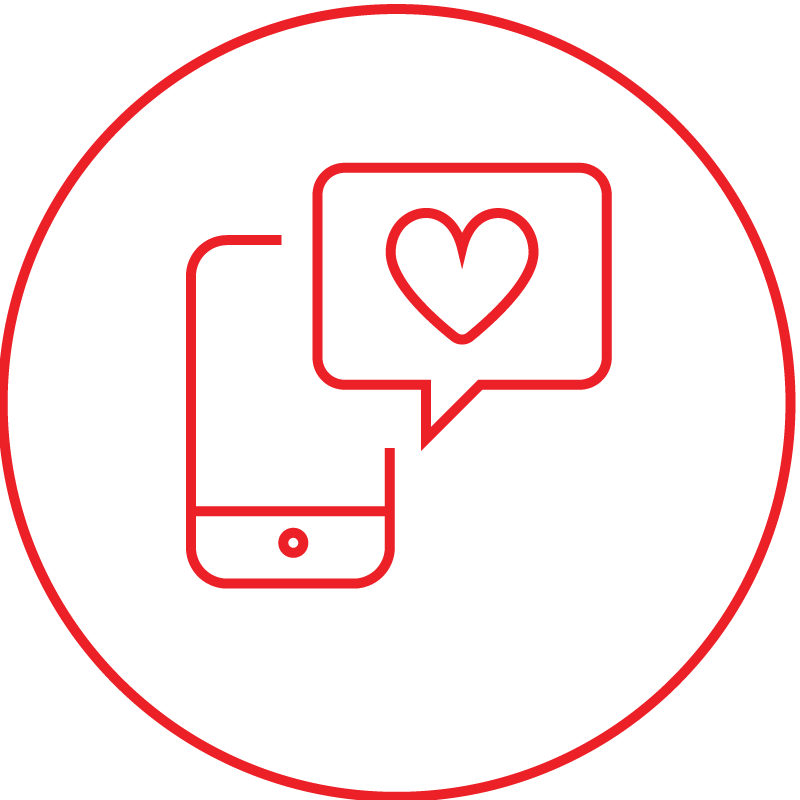 Smartphone mit Sprechblase und rotem Herz als Symbol für Social-Media-Marketing und digitale Kundenkommunikation eines Küchenstudios.